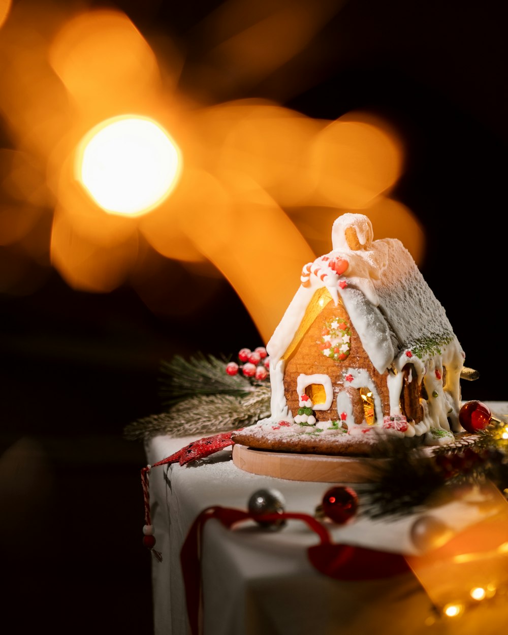 a small gingerbread house is decorated with christmas decorations
