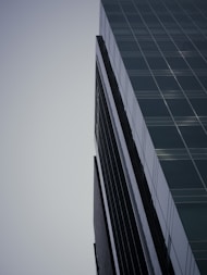 a very tall building with a sky in the background