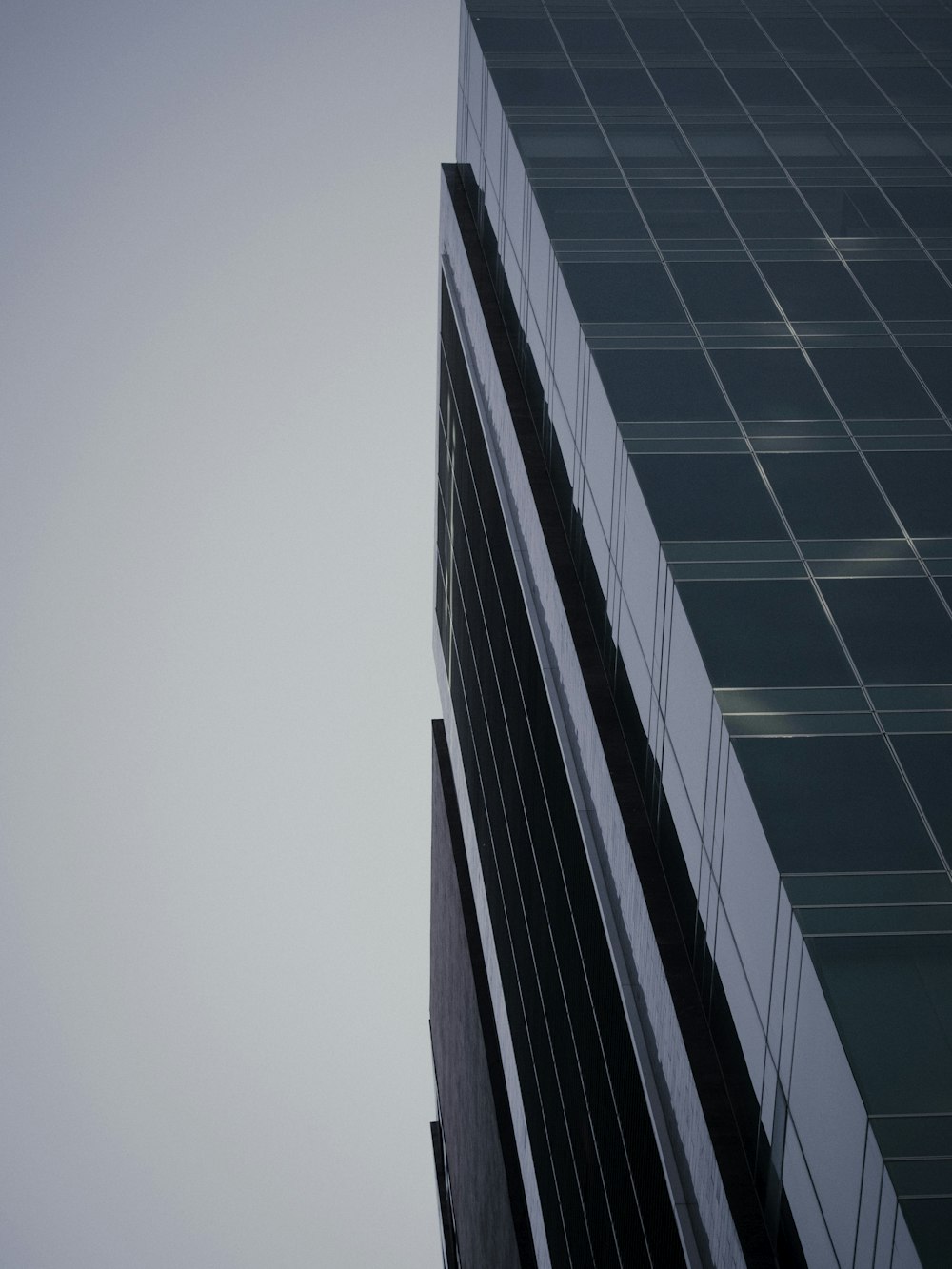 a very tall building with a sky in the background