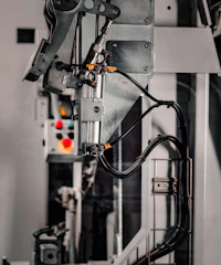 a close up of a machine with wires attached to it