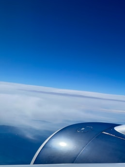 A scenic view of an airplane flying in the sky.