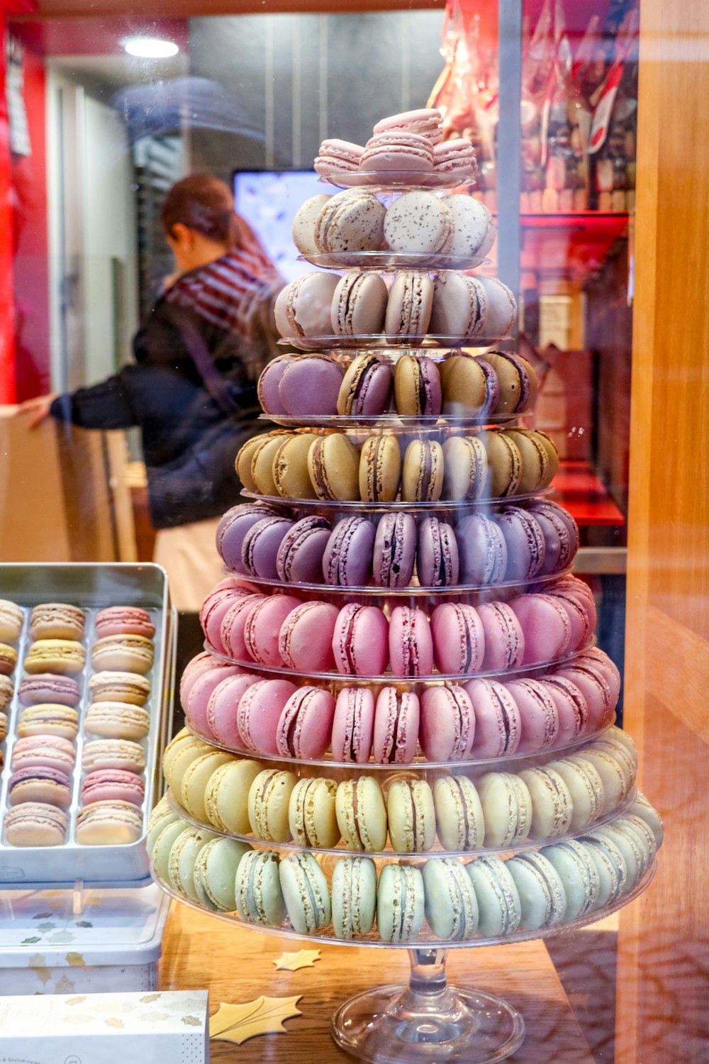 a tower of macaroons in a store window