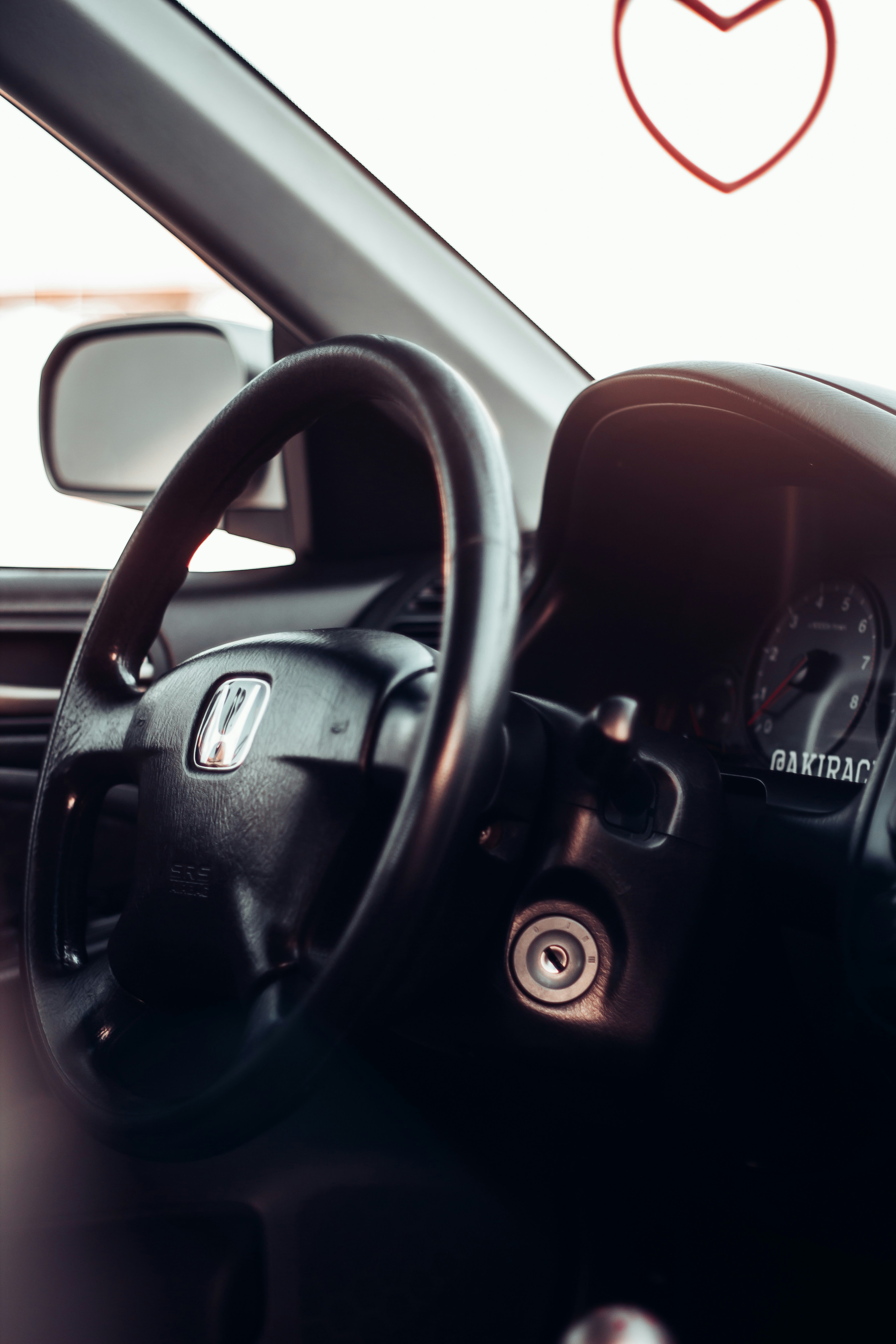 the interior of a car with a steering wheel
