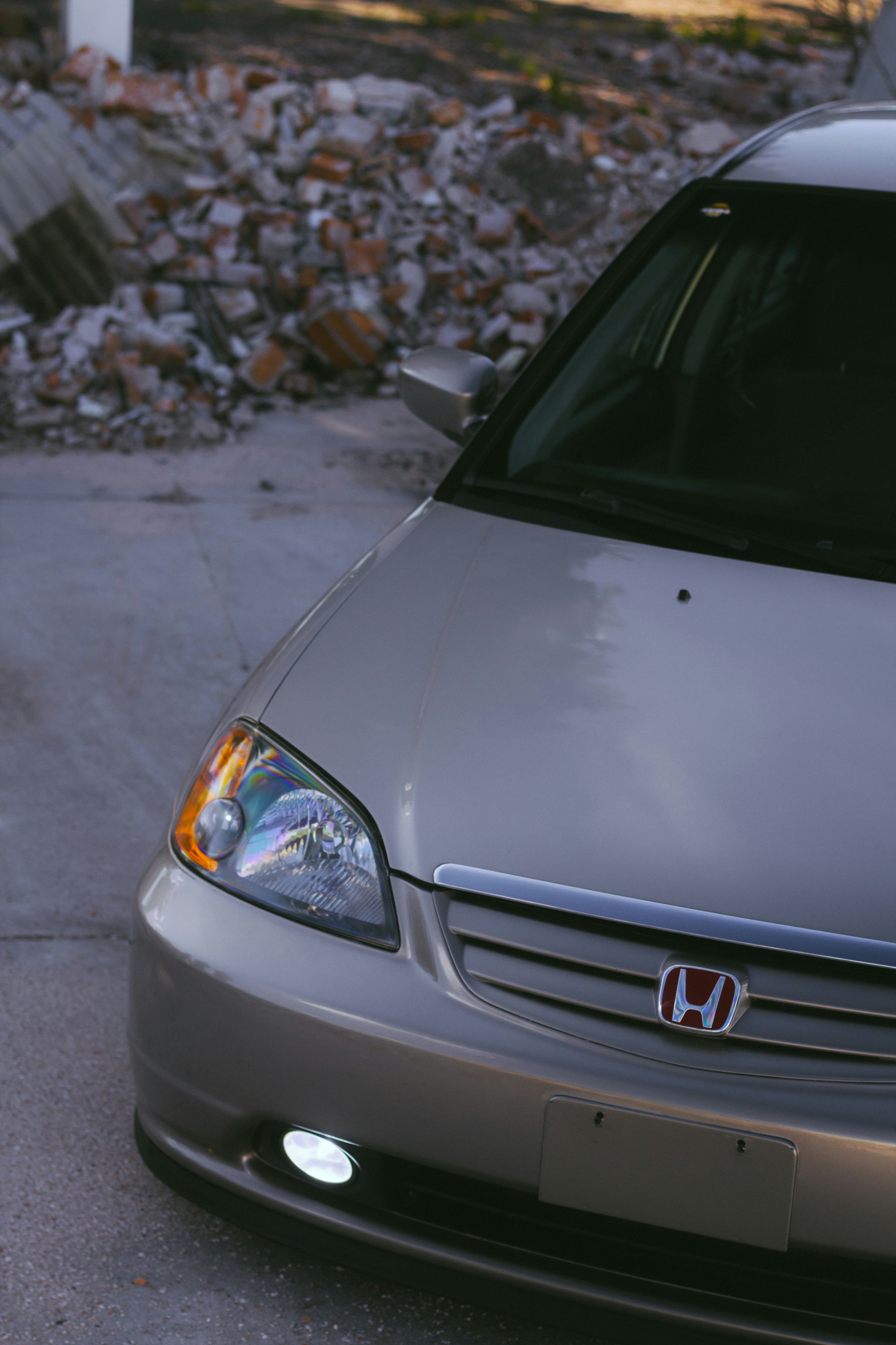 a silver car parked on the side of a road