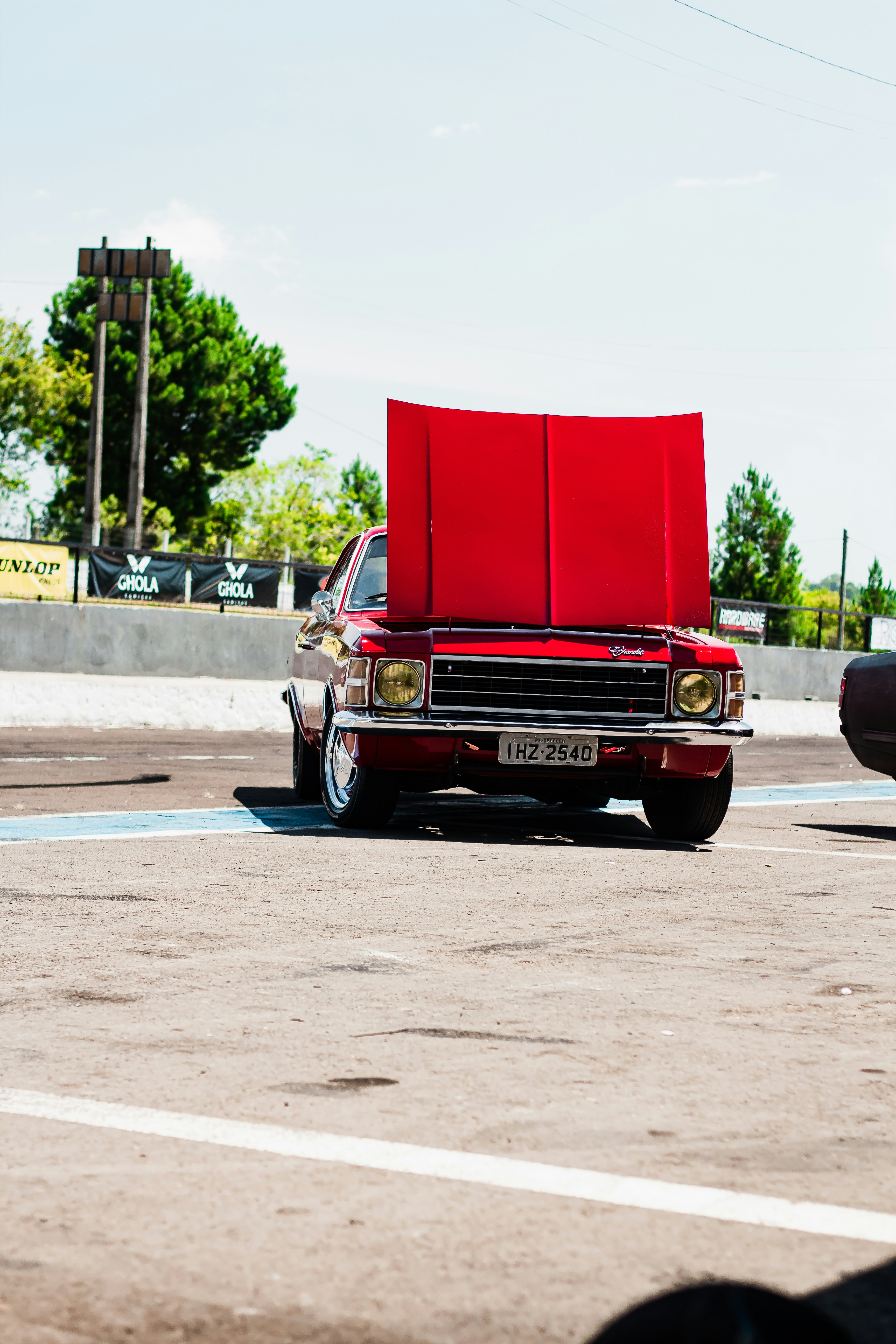 a red car parked in a parking lot