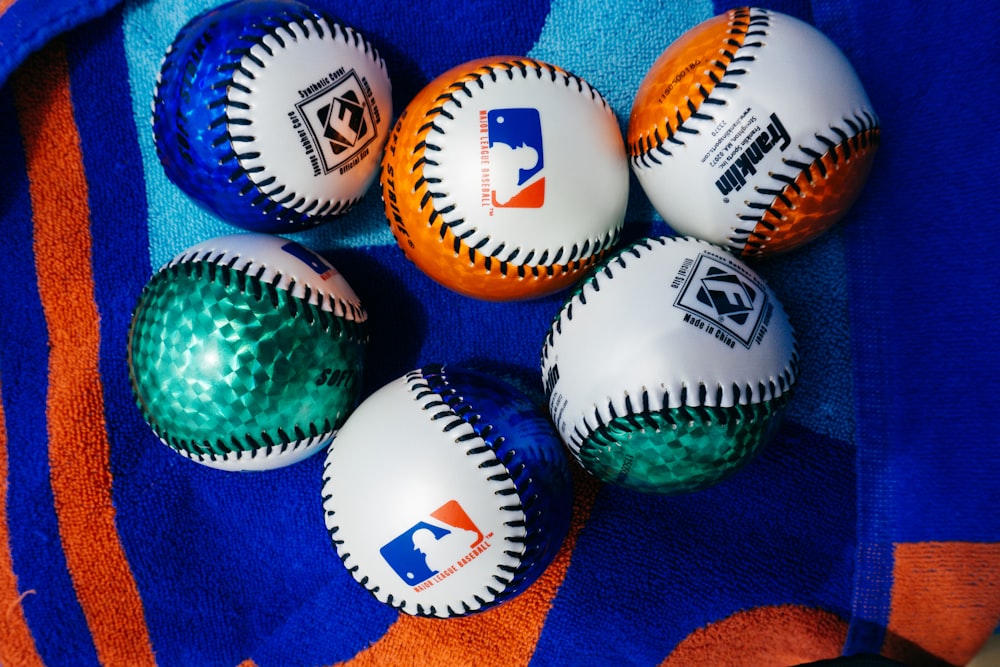 a group of baseballs sitting on top of a towel