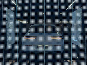 A vibrant auto review card glowing with neon blue and purple highlights, set against a modular niche galaxy backdrop.