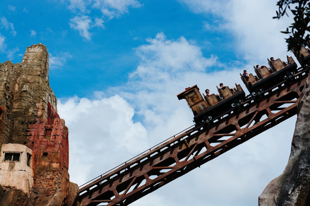 a roller coaster with people on top of it, Disney