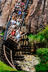 a group of people riding on a roller coaster