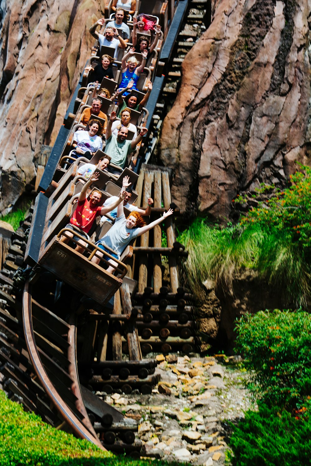 a group of people riding on a roller coaster