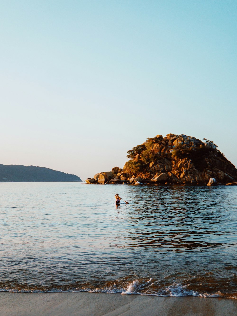 a person swimming in a body of water