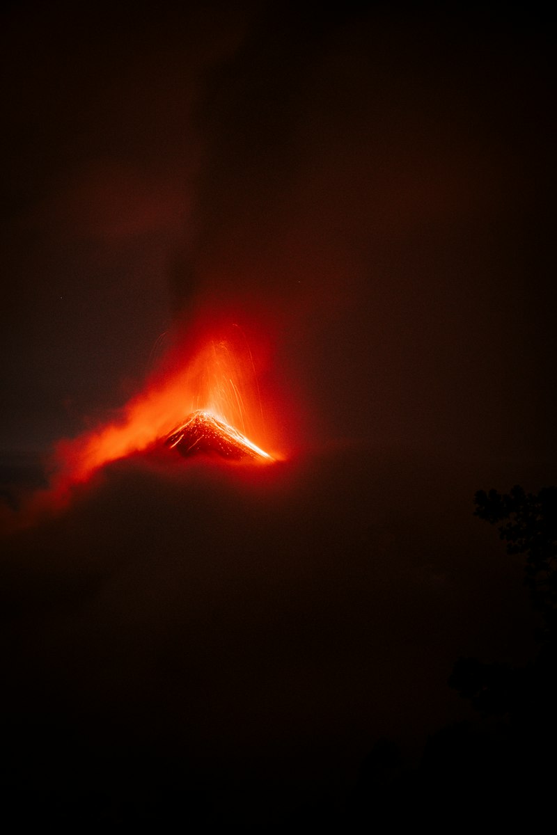 Active volcano erupting lava and ash into the night sky – representing Ambrym's twin craters Marum and Benbow