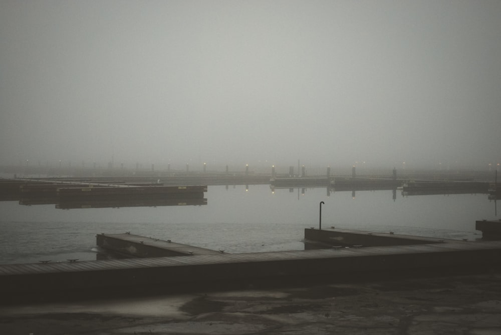 a body of water with a dock in the middle of it