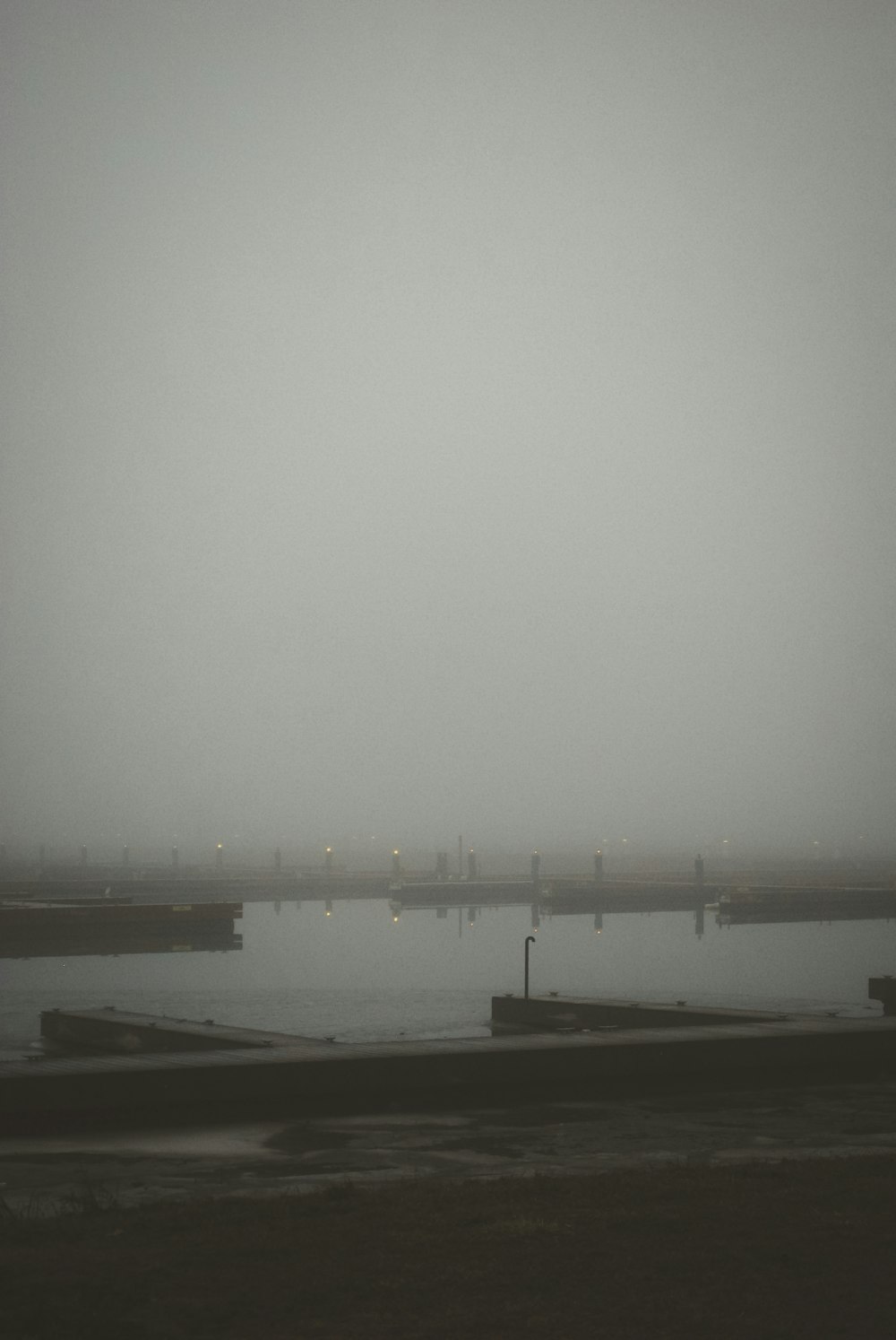 a large body of water sitting under a cloudy sky