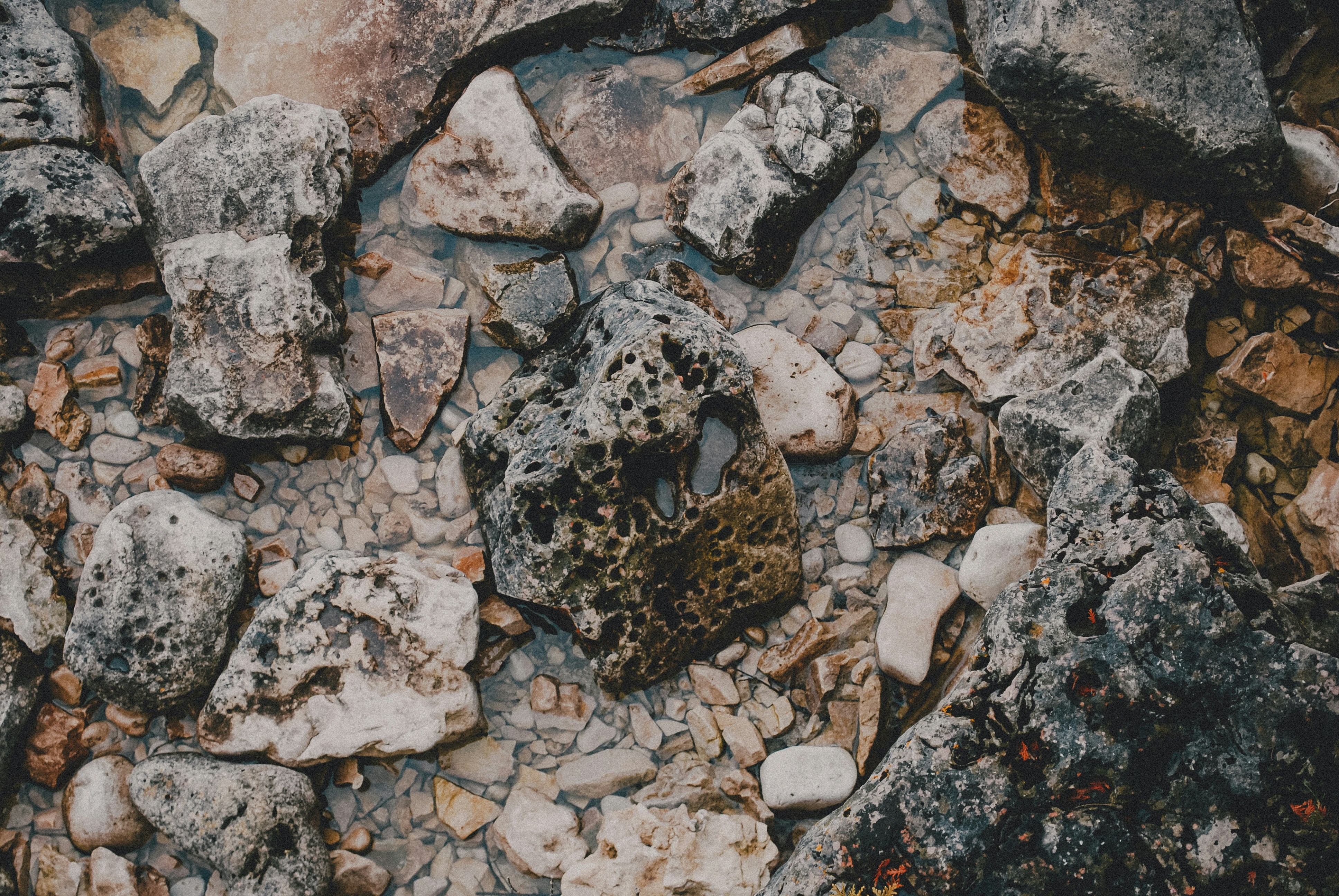 a rocky area with rocks and dirt on the ground