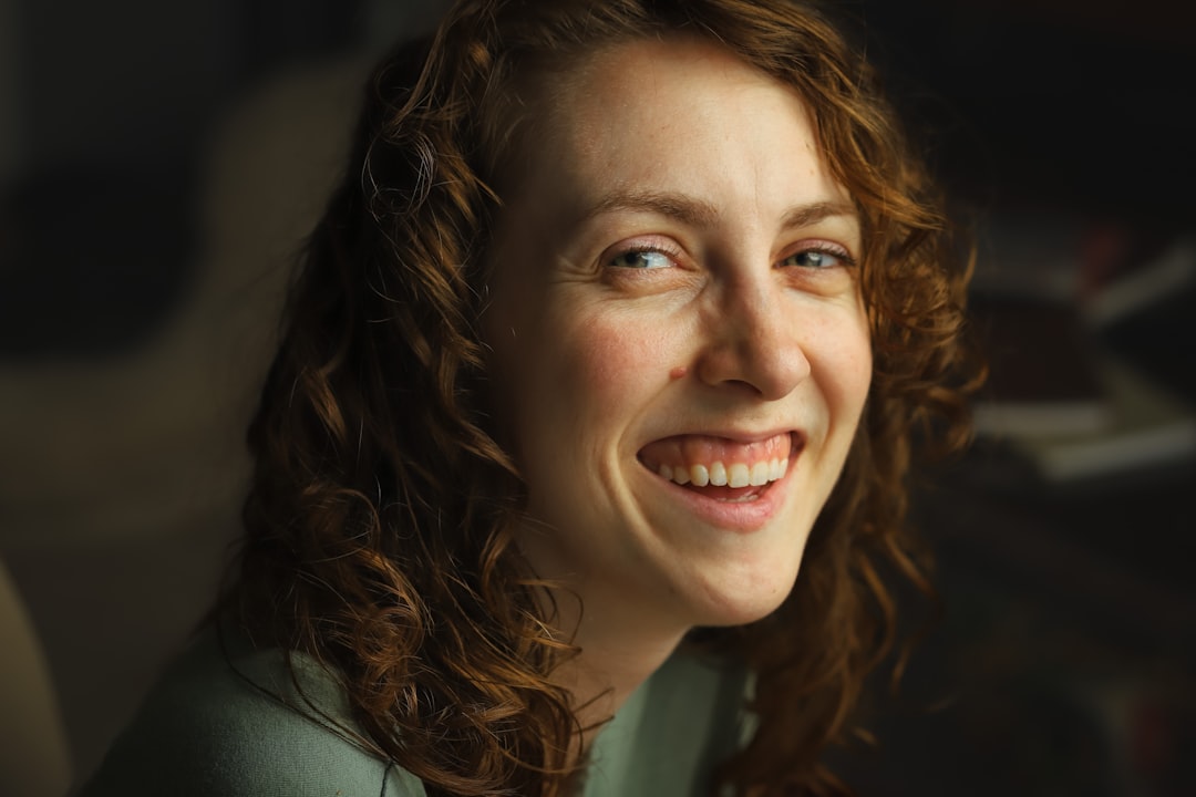 a close up of a person with a smile on their face, Headshot of a smiling female