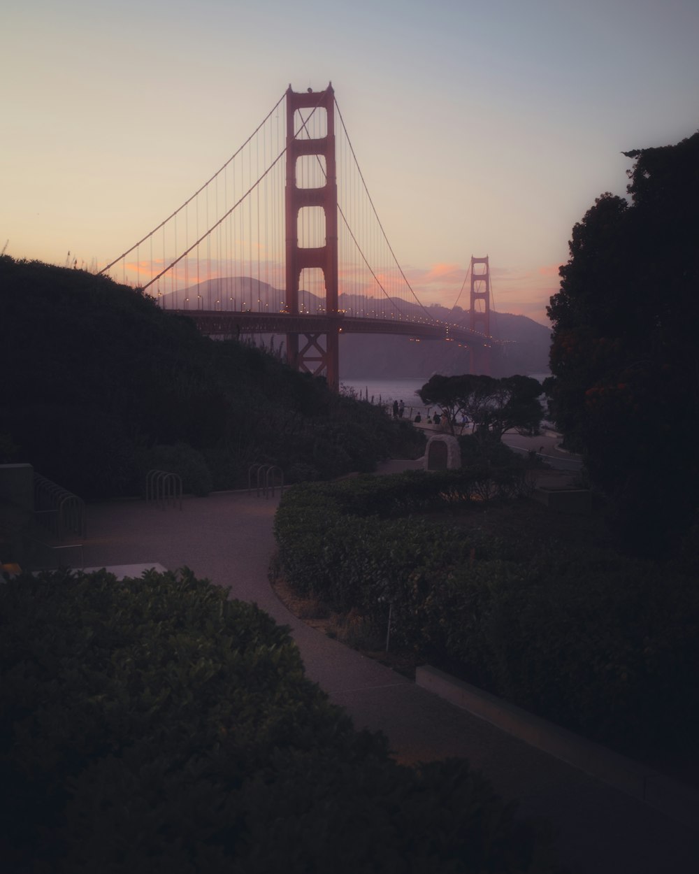 a view of the golden gate bridge at sunset