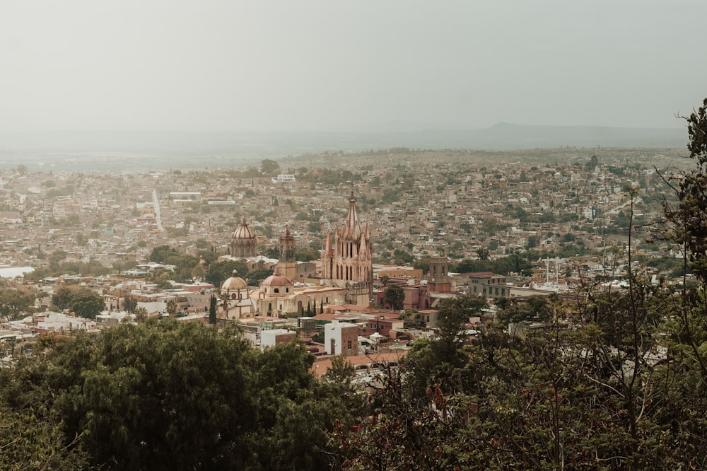 a view of a city from the top of a hill