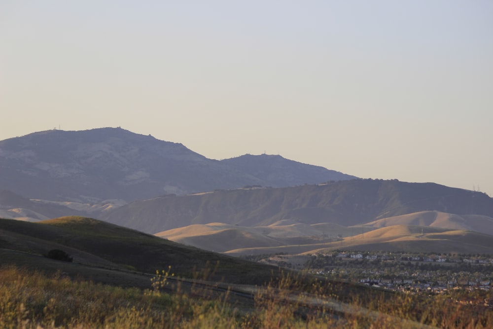 a view of a mountain range with a town in the distance