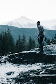 A serene outdoor scene featuring a person in a stylish sweater.