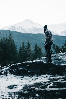 A serene outdoor scene featuring a person in a stylish sweater.