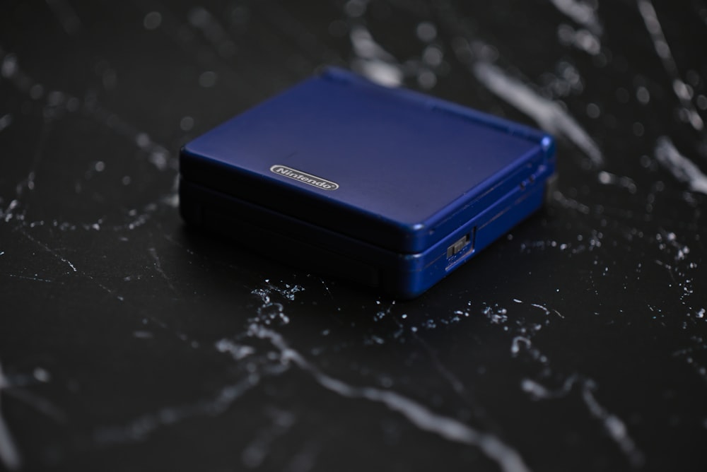 a blue box sitting on top of a black table