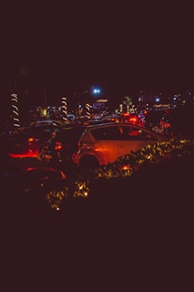 Evening traffic jam on a major Nigerian city highway with headlights glowing.