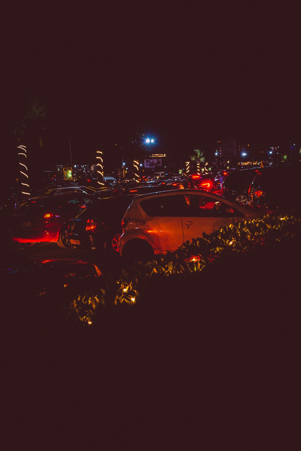 a parking lot filled with lots of parked cars