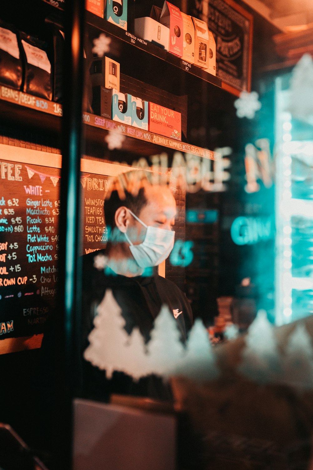 a man wearing a face mask in a restaurant