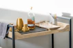 A sleek bar cart stocked with colorful glassware and fresh herbs, ready for entertaining.