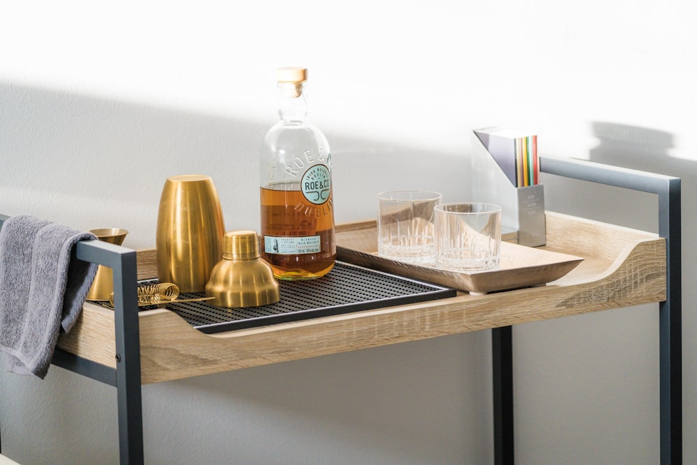 a bottle of alcohol sitting on top of a wooden table