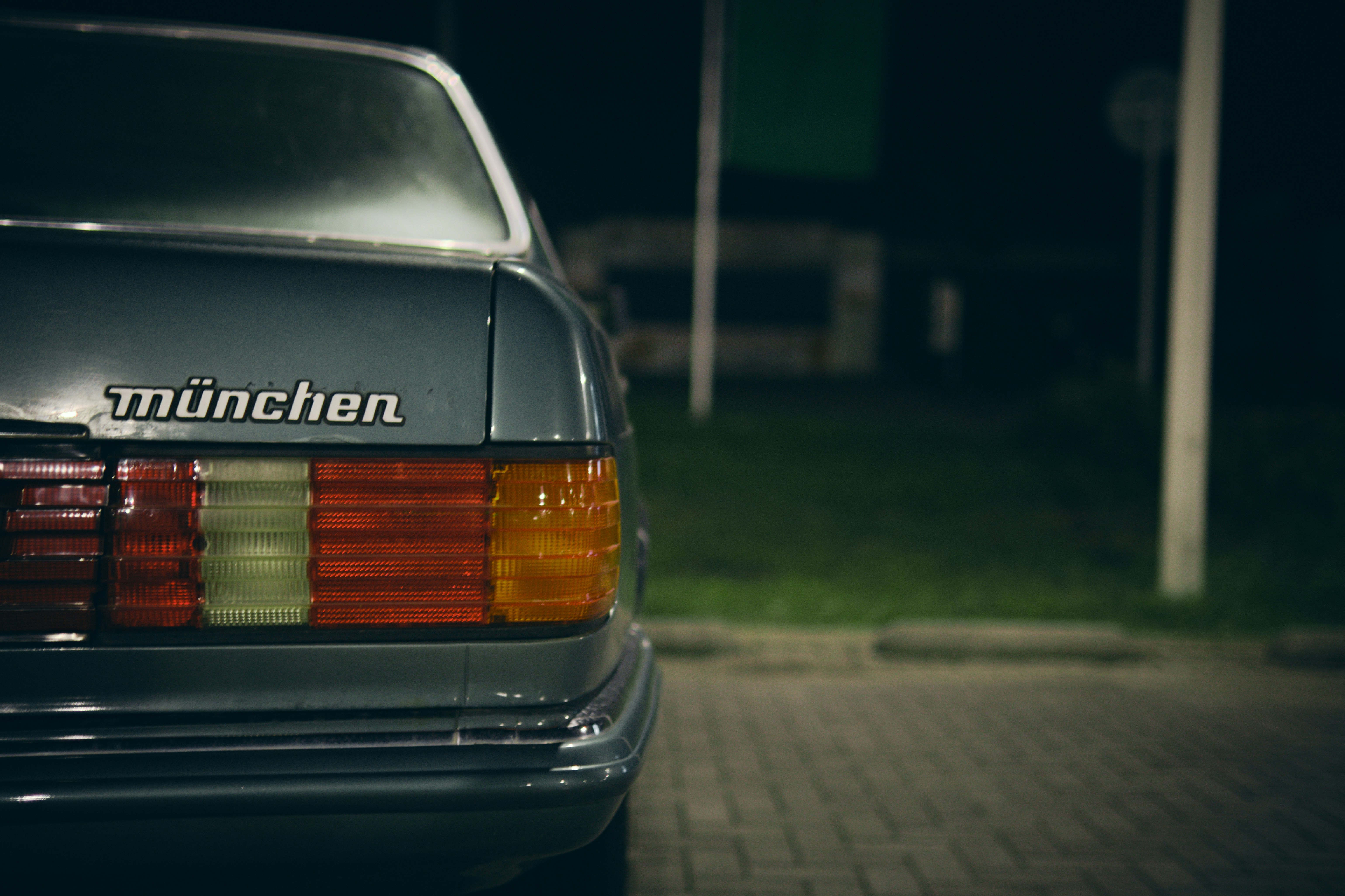 a close up of a car parked on the side of the road