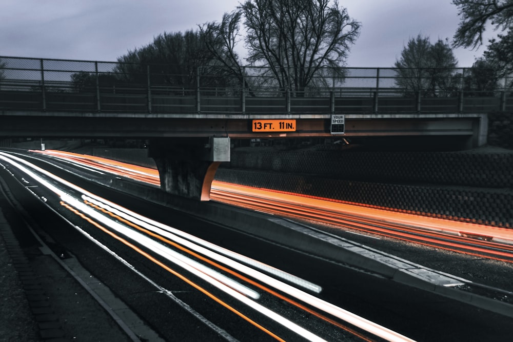 a highway with a speed limit sign above it