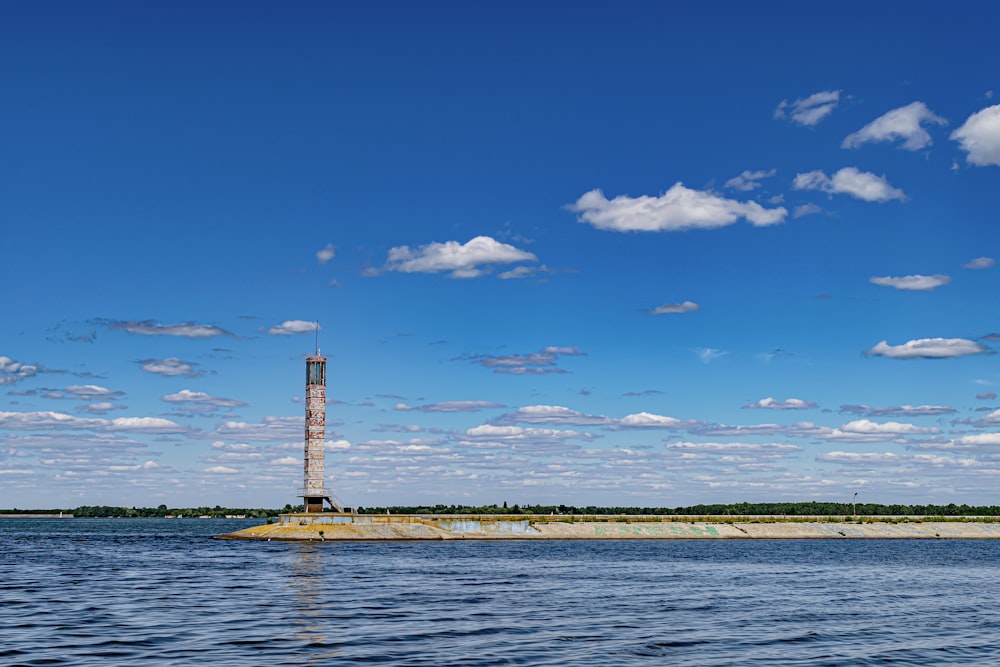 a large body of water with a tower in the middle of it