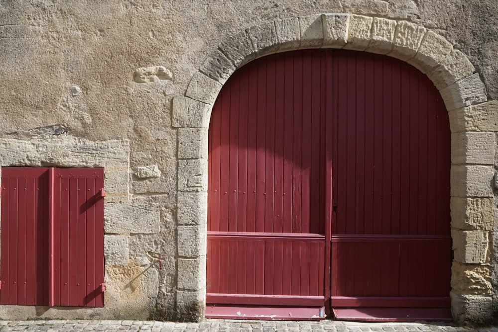 a couple of red doors sitting next to each other