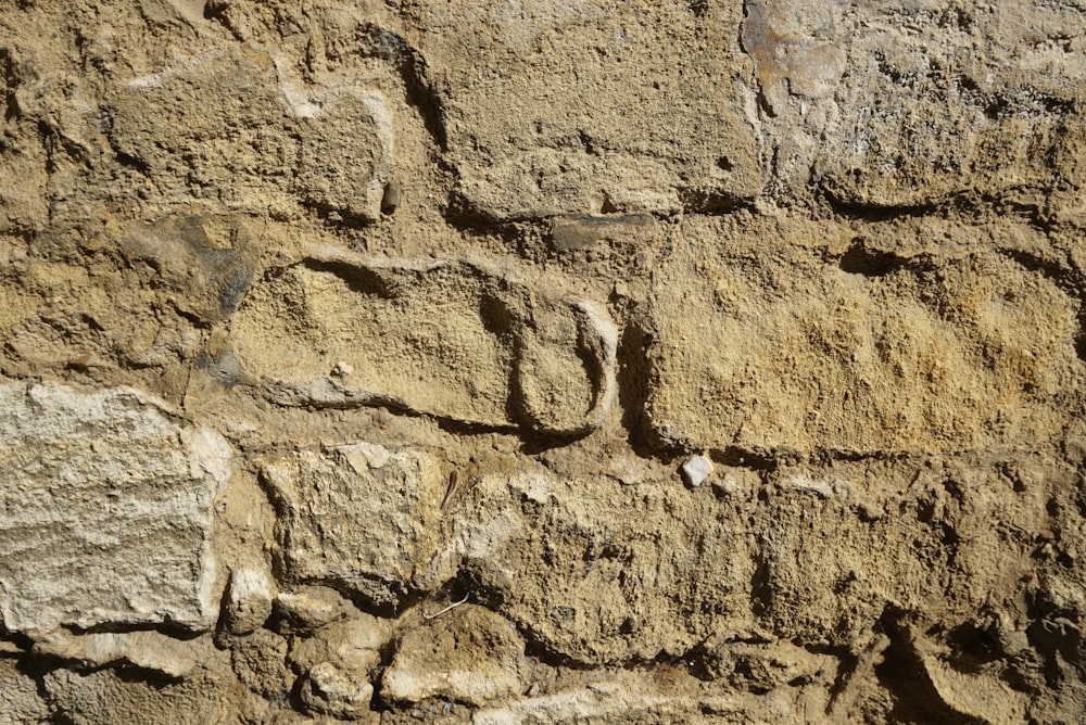 a close up of a wall made of rocks