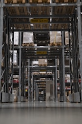 Wide view of heavy-duty storage racks loaded with industrial goods in a warehouse.