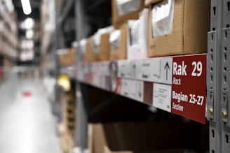 a rack of boxes in a large warehouse