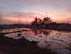 Finished civil construction site with soft pink sky at sunset