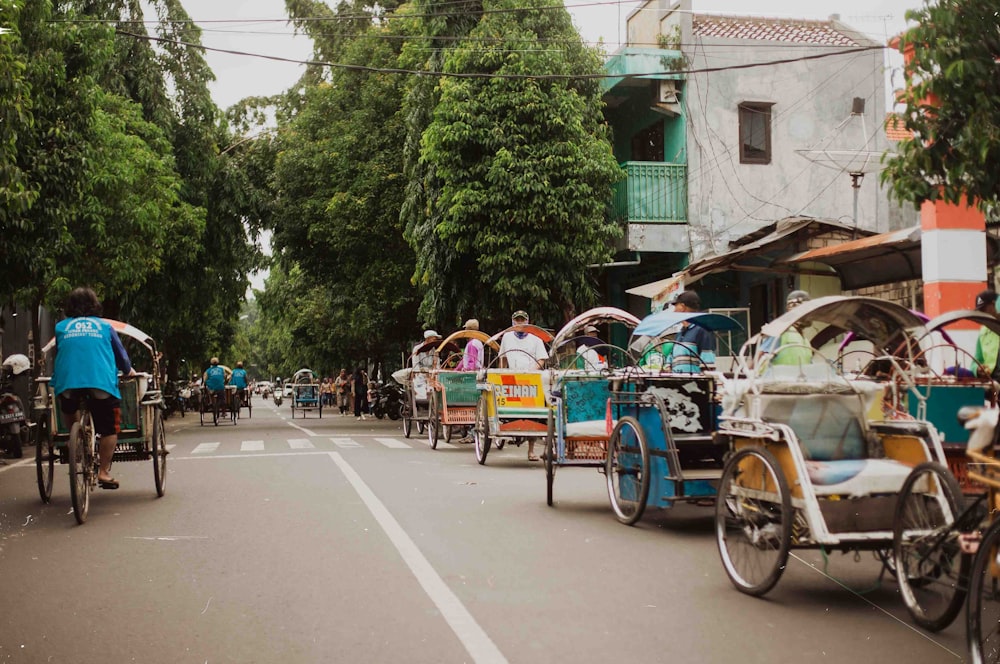 a group of people riding bikes down a street