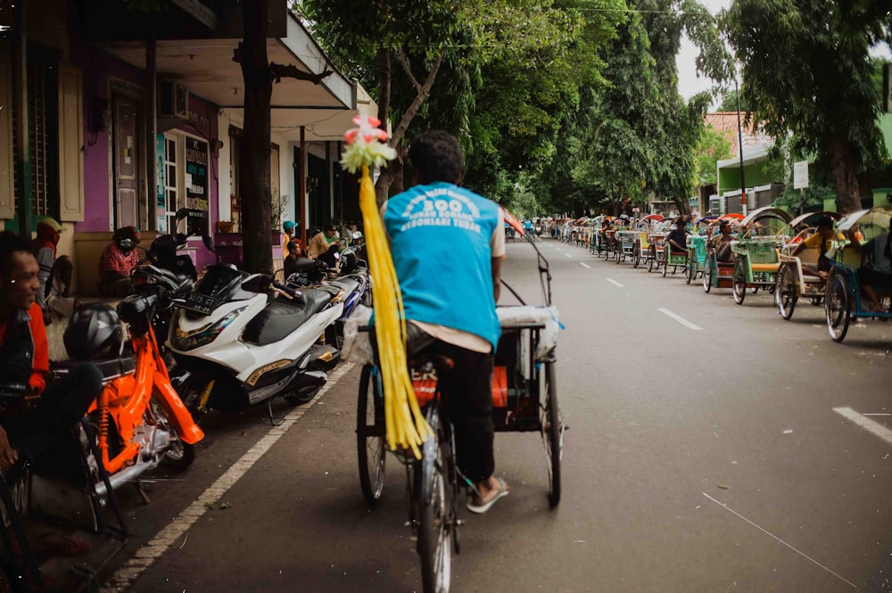 a person riding a bike down a street