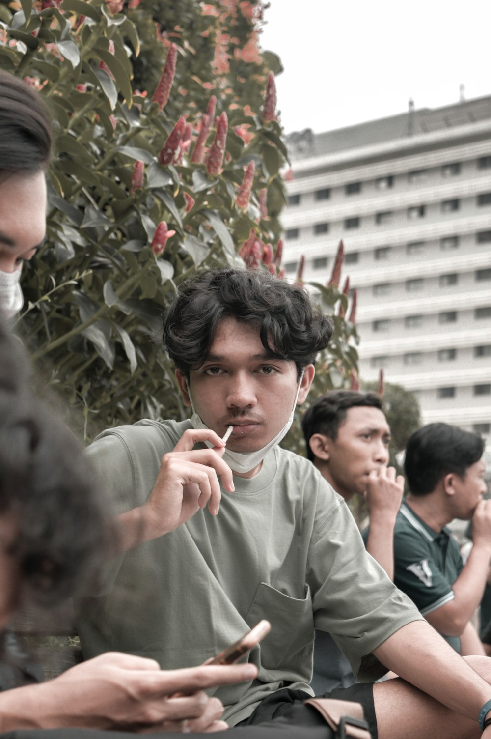 a group of young men sitting next to each other