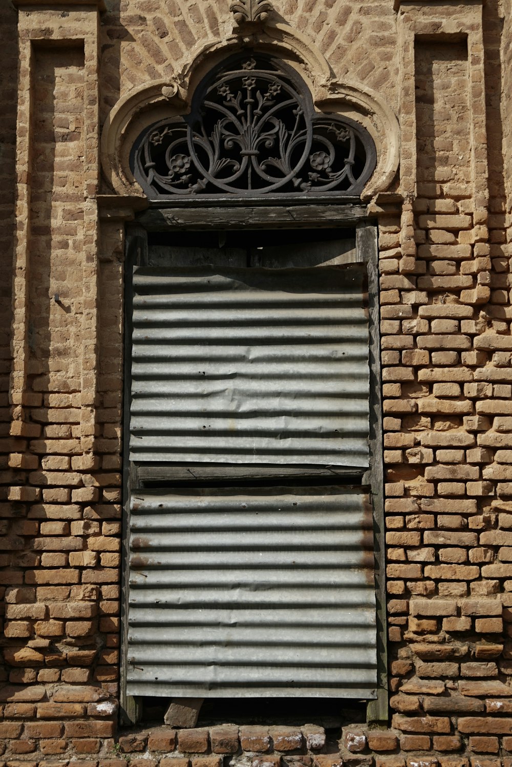 an old building with a closed metal door