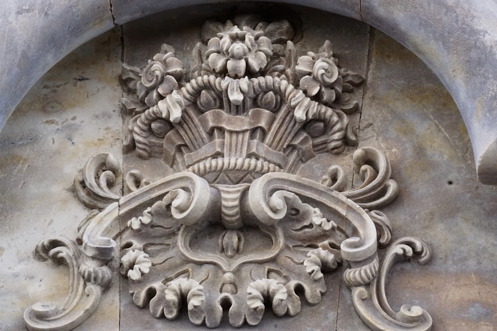 a close up of a decorative object on a building