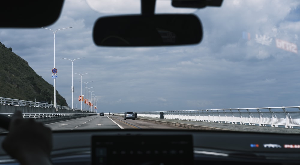 a view of a bridge from inside a car