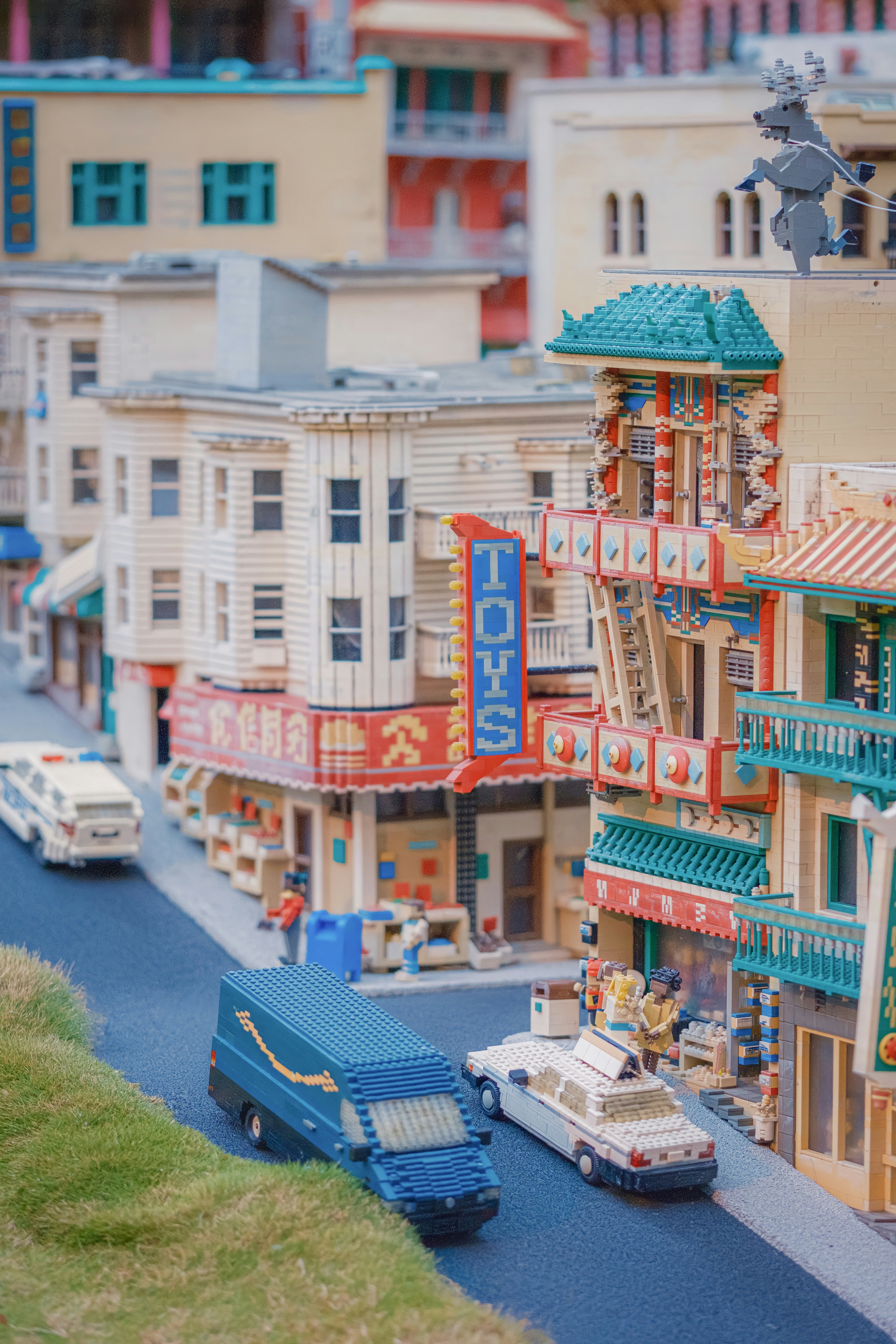 a model of a city with cars and buildings