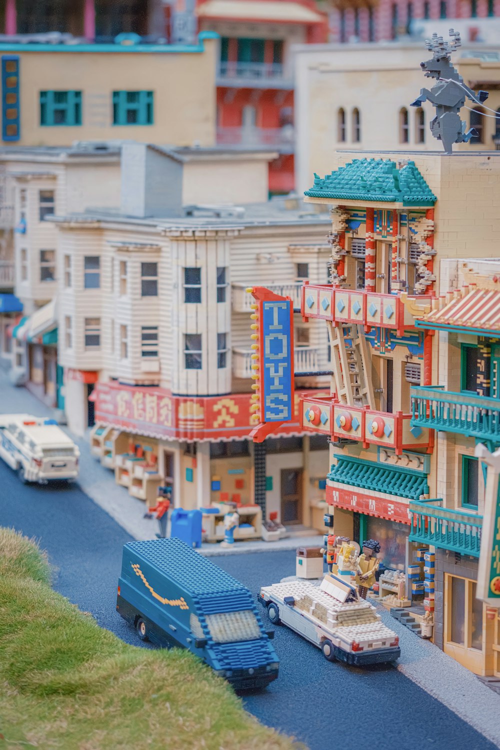 a model of a city with cars and buildings