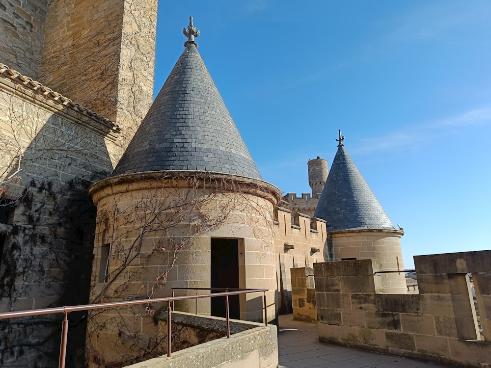 a stone building with two towers on top of it