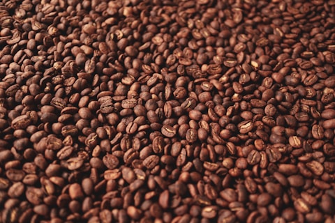 a pile of coffee beans sitting on top of a table