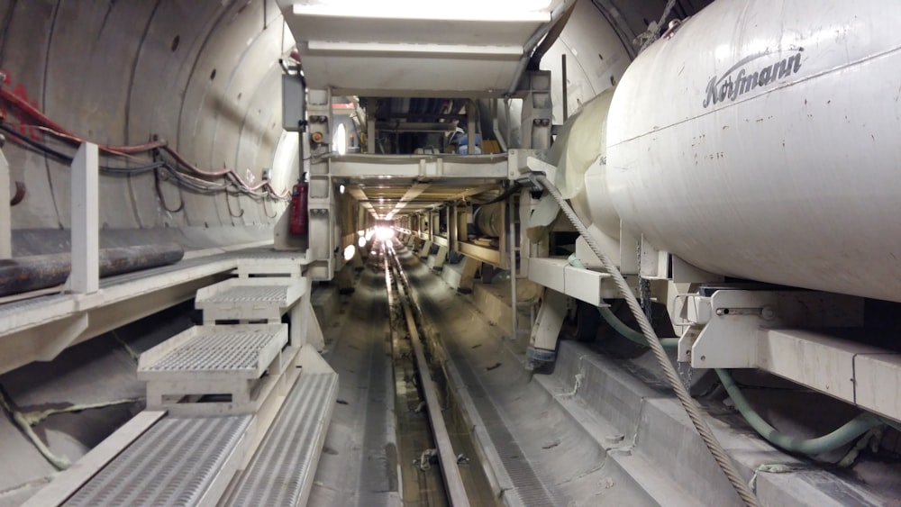 the inside of a large airplane with stairs leading up to it